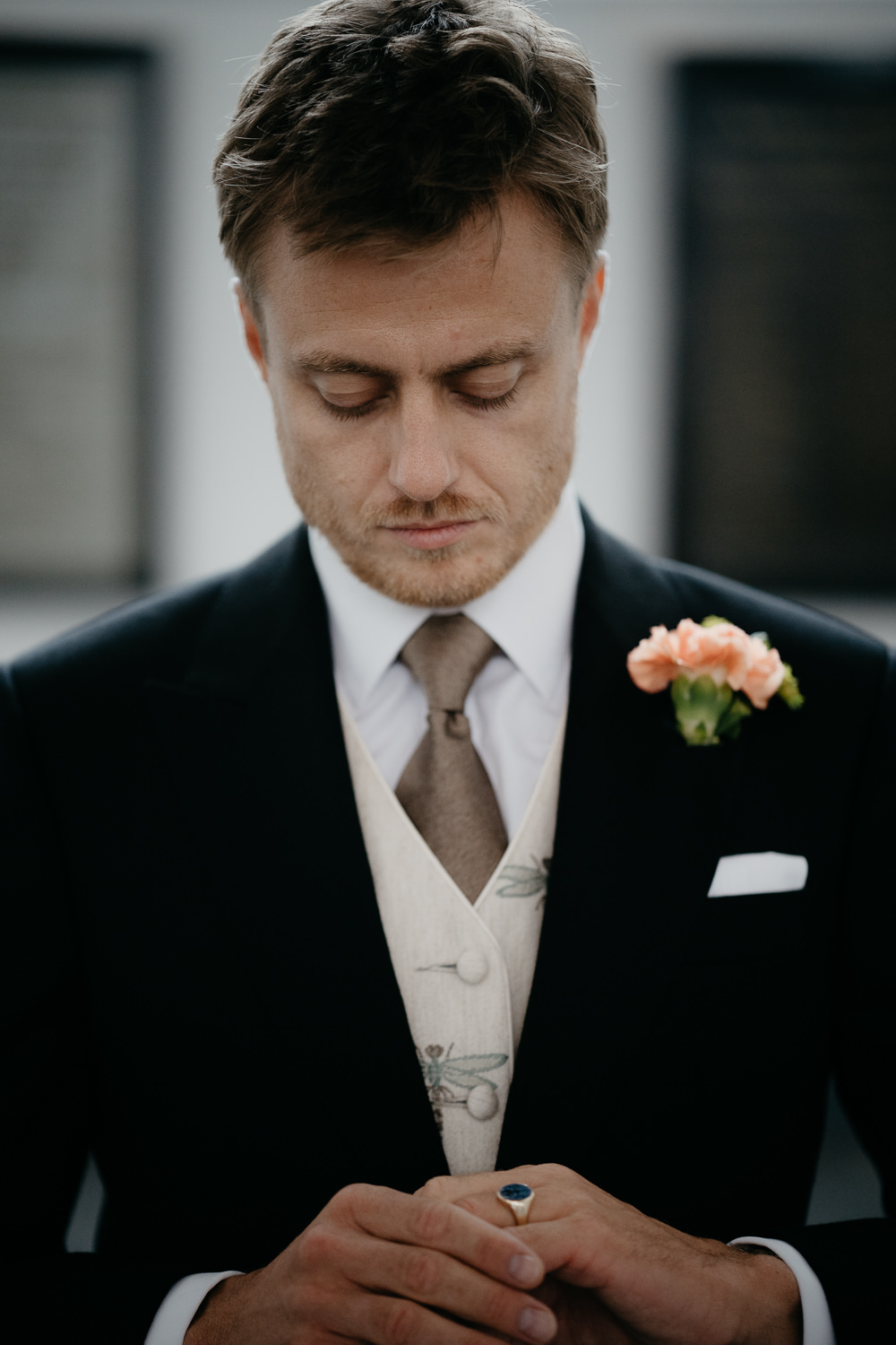 Groom preparing for wedding photography
